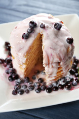 Delicious pancakes with berries and yogurt on plate