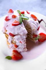 Delicious pancakes with strawberry and yogurt on plate
