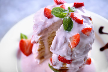 Delicious pancakes with strawberry and yogurt on plate