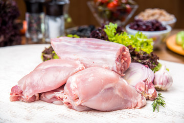 Fresh rabbit meat, carcass, on a wooden table