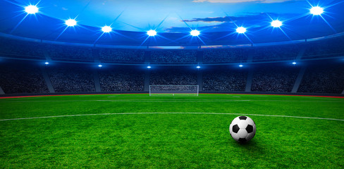 Soccer ball on green stadium