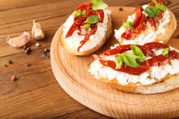 Italian sandwiches - bruschetta with cheese, tomato and basil
