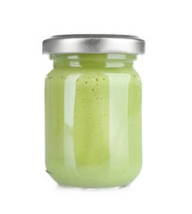 Glass jar of wasabi isolated on white