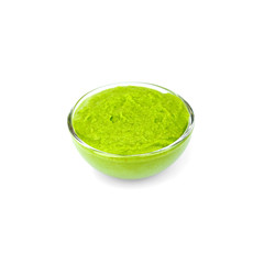 Bowl of delicious wasabi sauce isolated on white