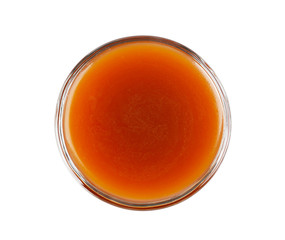 Bowl of delicious caramel sauce isolated on white