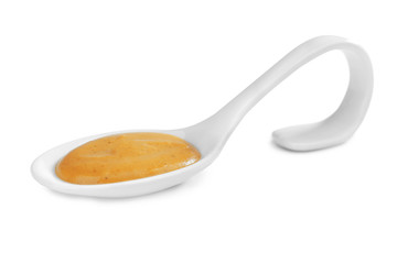 Spoon with delicious mustard sauce isolated on white