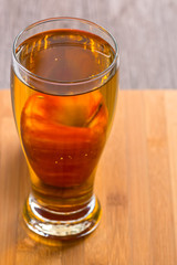Apple juice in a glass with a red Apple