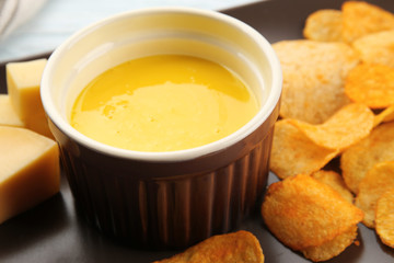 Bowl of creamy cheese and chips, close up