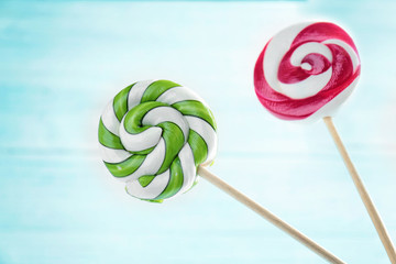 Multicolored lollipops on white background
