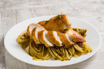 fried chicken and chicory in sauce