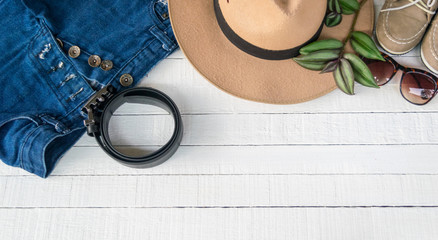 Dress Accessories women Jeans and hats sunglasses shoes on a white background.
