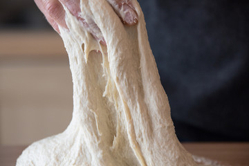 Kneading sourdough for rustic bread