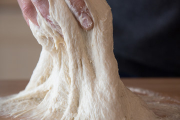 Kneading sourdough for rustic bread