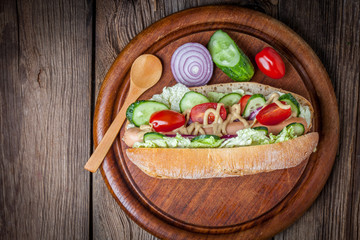 Homemade sandwich on a wooden table.