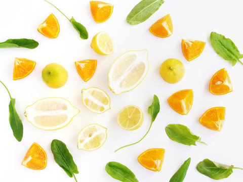 Fruit pattern. Cut fruit on a white background. Citrus in the cut. Food background. Composition of fruits oranges, lemons, kiwi.