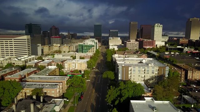 Aerial downtown Salt Lake City Utah sunrise part 1. Drone flight downtown city center. Tall skyscraper building and religion area. Early summer mountain valley urban traffic.