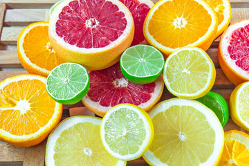Fototapeta na wymiar Fresh choped slices of different types of citrus
