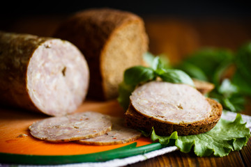 A sandwich with homemade sausage and rye bread