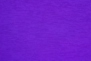 Bright purple colored textured stucco background