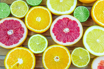 Fototapeta na wymiar Fresh choped slices of different types of citrus