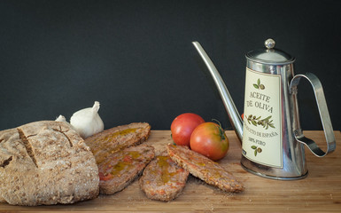 Typical spanish breakfast with bread tomato garlic and olive oil.