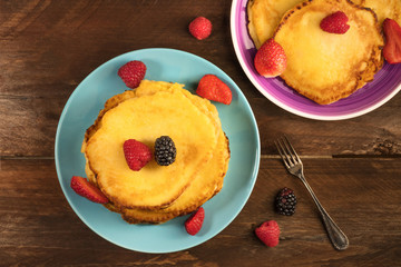 Freshly baked homemade pancakes with fresh fruit
