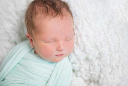 Baby Wrapped Up In Light Blue Blanket