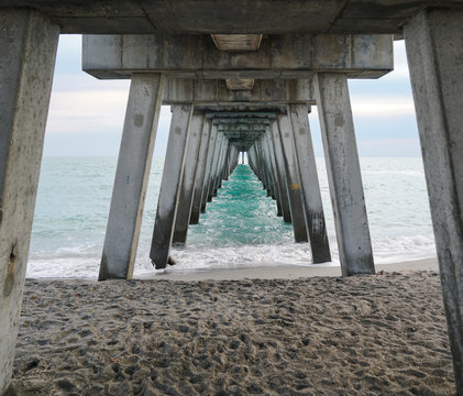 Fototapeta The underside of one of the many fishing piers on the Gulf of Mexico.