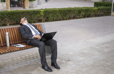 businessman fallen asleep in Dubai Marina