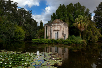 The Doric temple and the lilly pond in the gardens of the Royal Palace of Caserta - obrazy, fototapety, plakaty