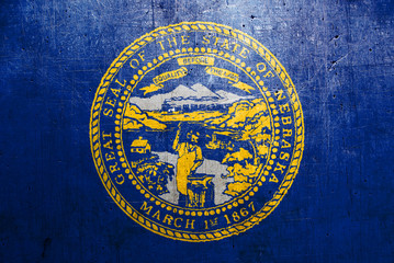 Obraz premium Flag of Nebraska, USA, with an old, vintage metal texture