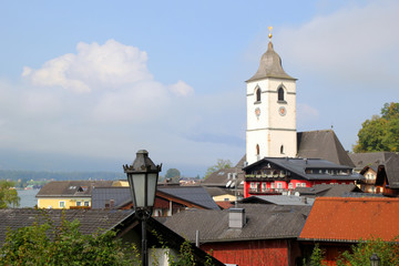Travel to Sankt-Wolfgang, Austria. The view in the buildings and a lantern on the mountains city.