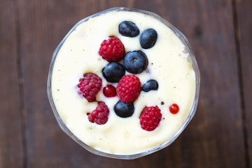 Dessert with berries - blueberries, raspberries and currants