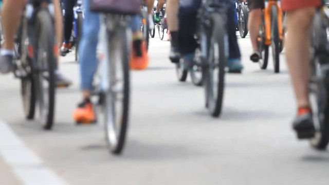 People group of cyclists go to the city