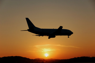 Fototapeta na wymiar Airplane silhouette just before touching down (Corfu, Greece) 