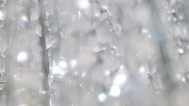 Crystal chandelier. Close up of the crystals. 
Close up shot of a big beautiful crystal luxury chandelier. With bling bling shining reflection.
