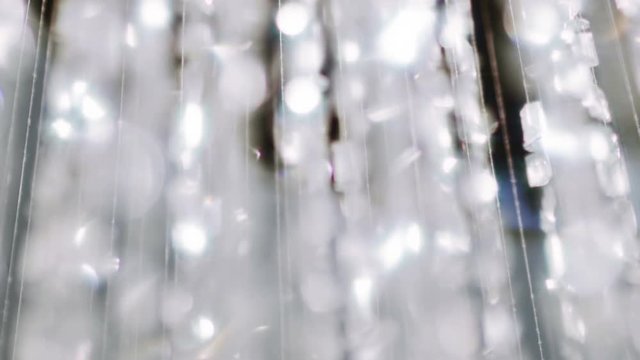 Crystal chandelier. Close up of the crystals. 
Close up shot of a big beautiful crystal luxury chandelier. With bling bling shining reflection.
