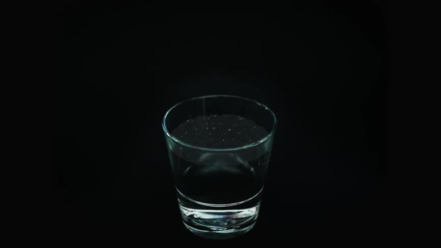 Hurricane in glass of water (dark background) 4K (loop)
Tempest in teapot. Storm in teacup. Metaphor, symbol over-reacted to small unimportant event, as if it were of considerably more consequence. 