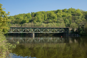 Fototapeta na wymiar Railway Bridge Steel Over The River Ruhr In Essen Kettwig / Kettwiger See