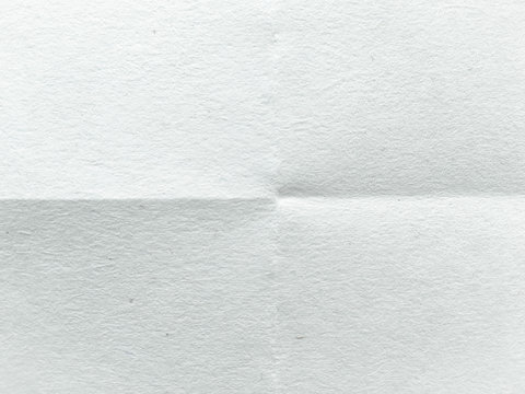 White paper folded to four. White paper texture