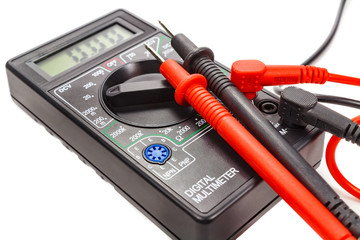 Digital multimeter with probes on a white background