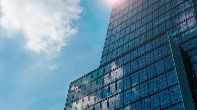 Office building with sun flare and cloud reflection 4K
Attractive office building timelapse background with sun flare and fast moving cloud.
