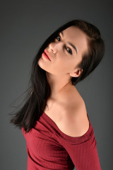 Naklejka premium Beautiful woman posing in studio on dark background