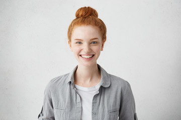 Portrait of positive cheerful teenage girl feeling happy, smiling broadly at camera after boy she...