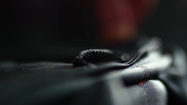 Fastening Zip on Luggage bag at Airport
