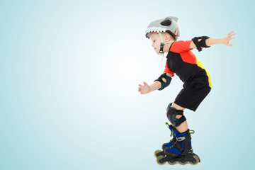 Fototapeta na wymiar Little boy riding on the rollers.