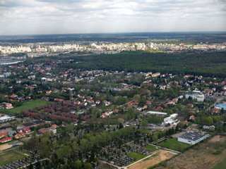 Aerial cityscape graveyard forest and buildings