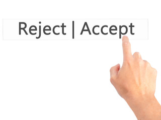 Accept  Reject - Hand pressing a button on blurred background concept on visual screen.