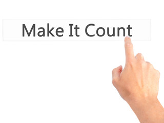 Make It Count - Hand pressing a button on blurred background concept on visual screen.