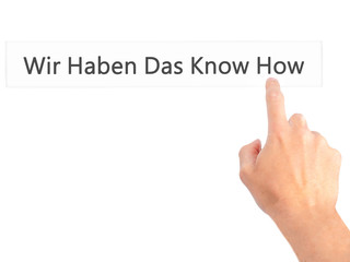 Wir Haben Das Know How! (We Have the Know-How in German) - Hand pressing a button on blurred background concept on visual screen.